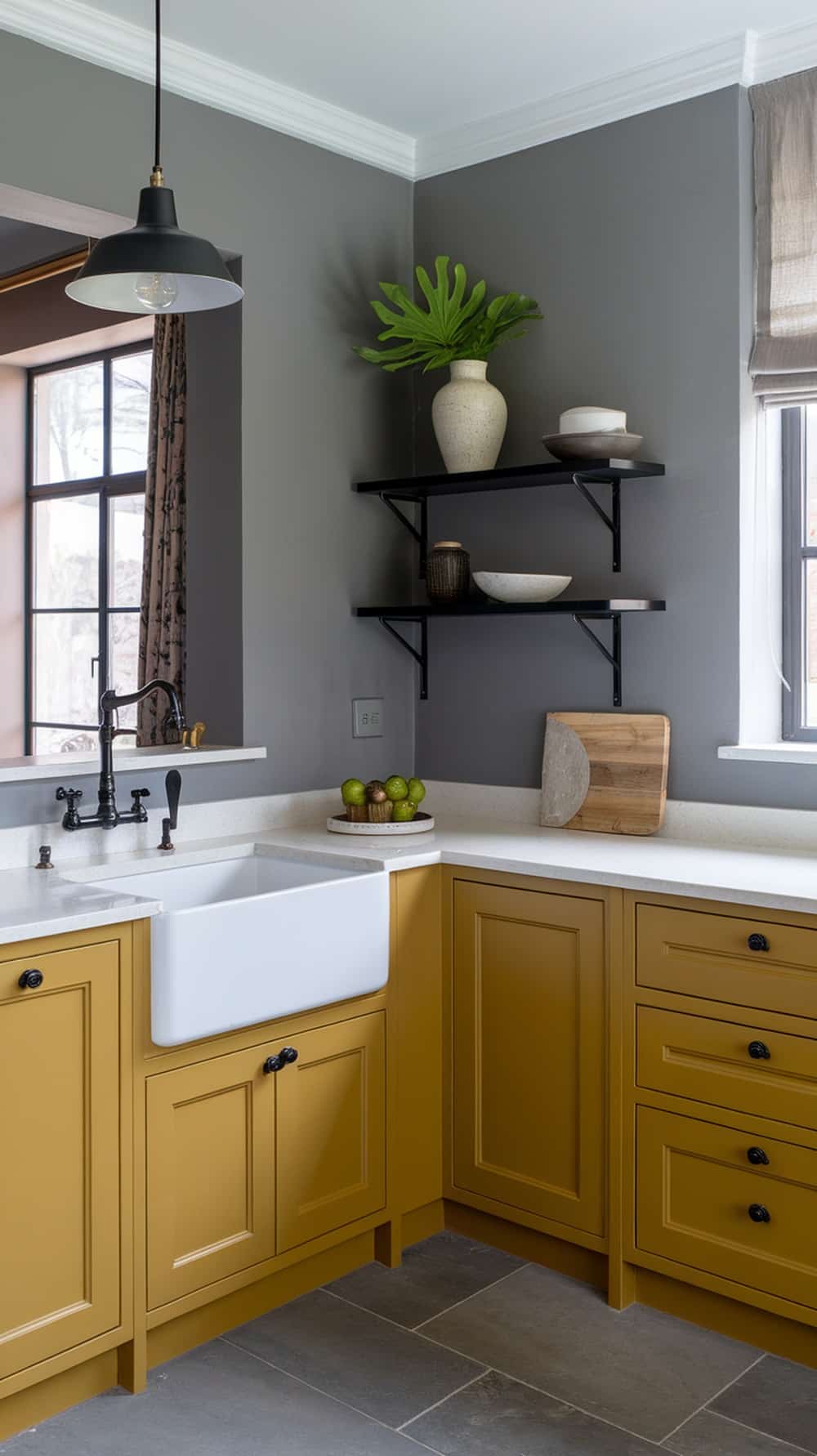 A kitchen featuring mustard yellow cabinets paired with gray walls and decor.