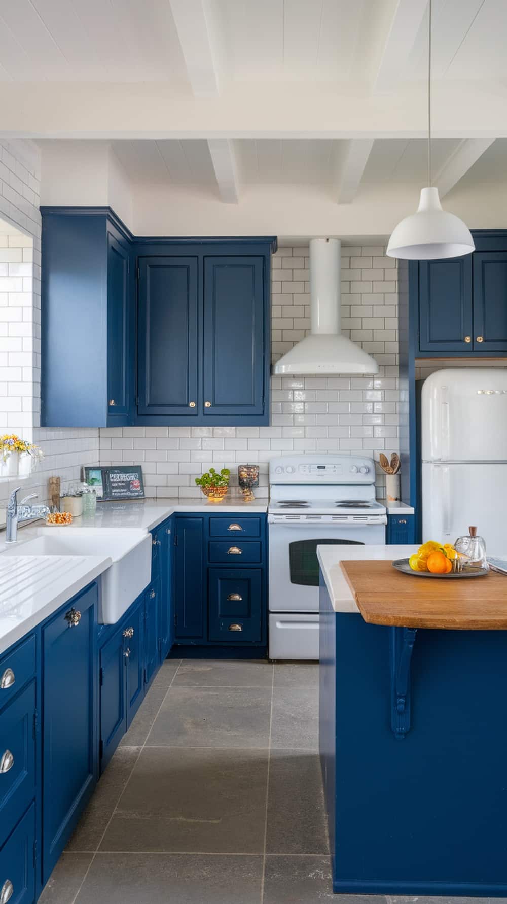 A kitchen featuring indigo cabinets and white tiles, showcasing a modern design.