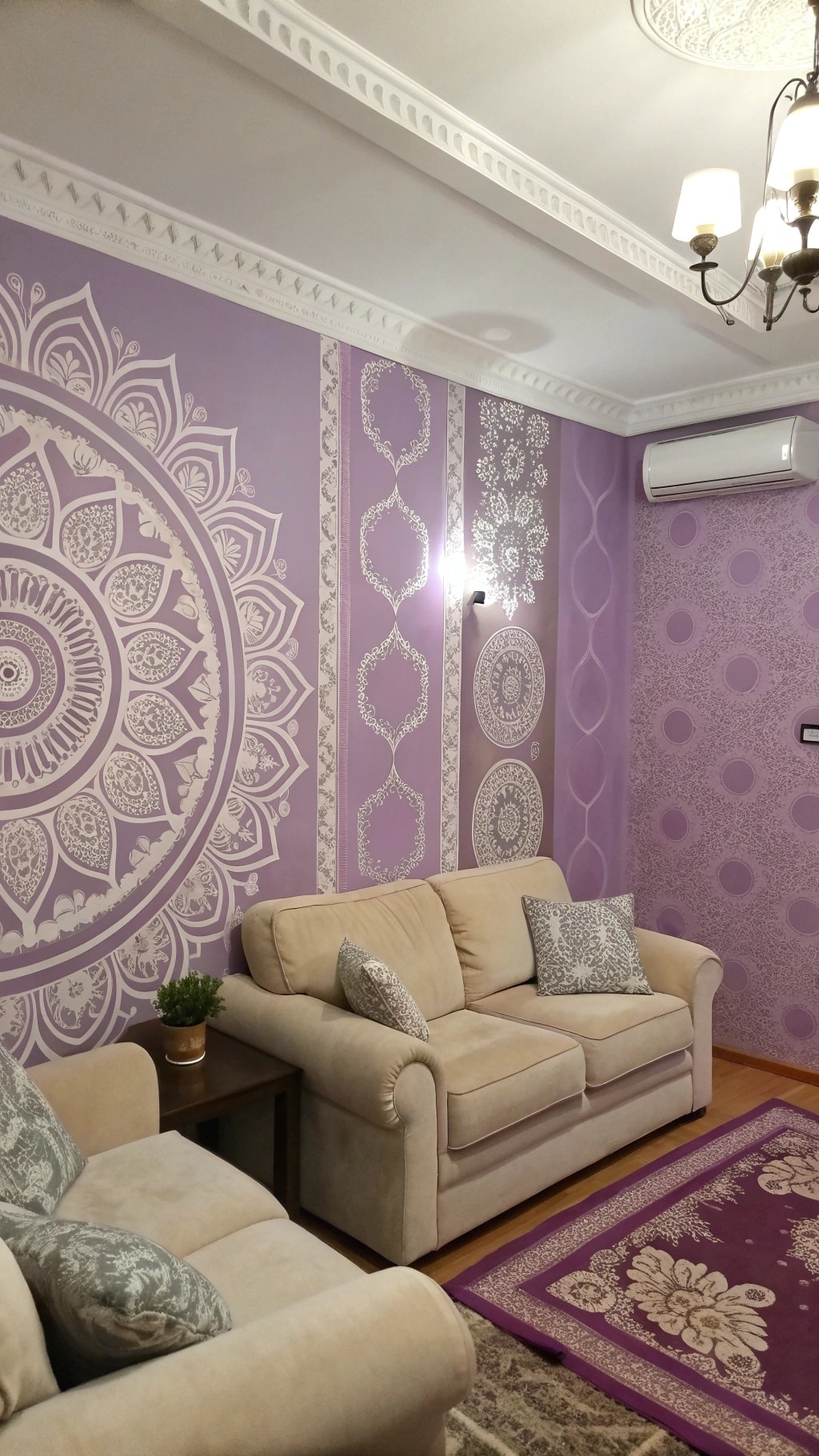 A living room with lavender walls featuring intricate white designs, beige sofas, and decorative cushions.