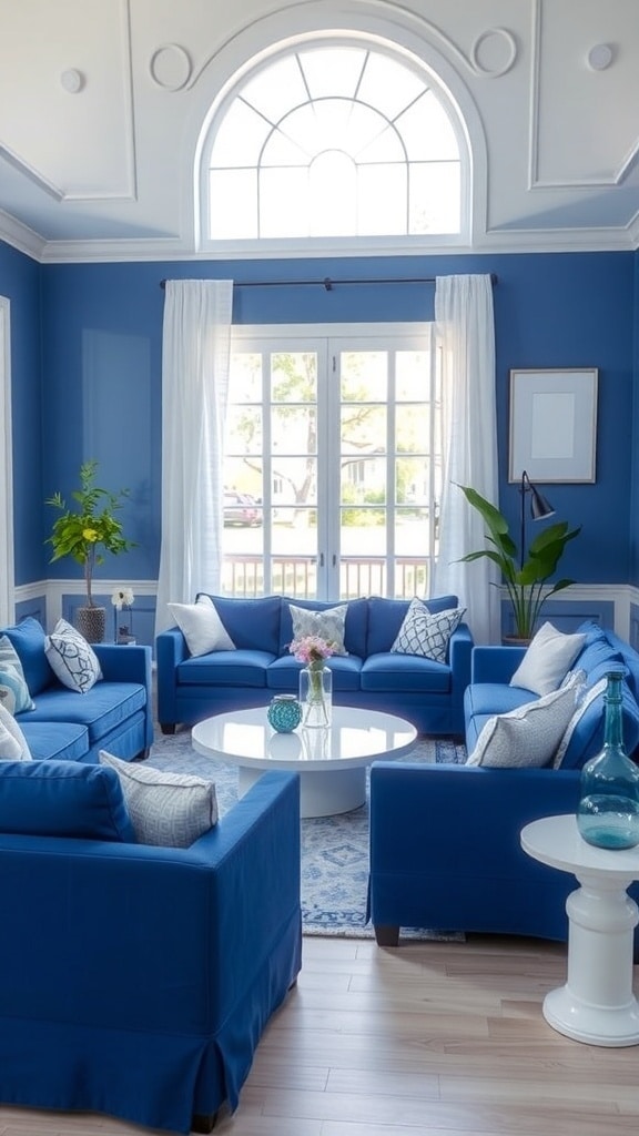 A serene living room with indigo walls and white furniture, featuring large windows and plants.