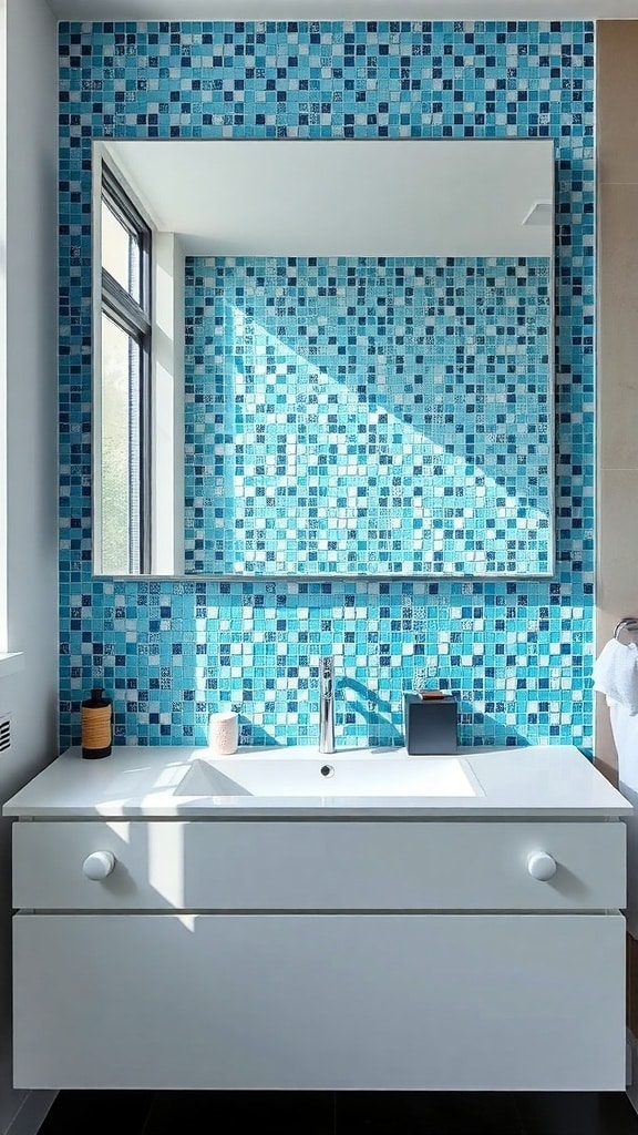 A bright bathroom featuring a blue mosaic backsplash with varying shades of blue tiles, a white vanity, and a large mirror.