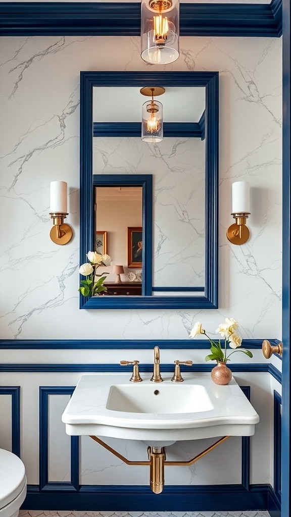 A navy blue framed mirror above a white sink with gold fixtures in a stylish bathroom.